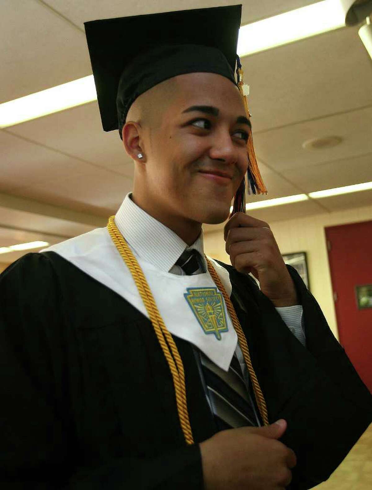 A.J. Planas of Bridgeport gets ready for his graduation at Platt Technical High School in Milford on Monday, June 20, 2011.