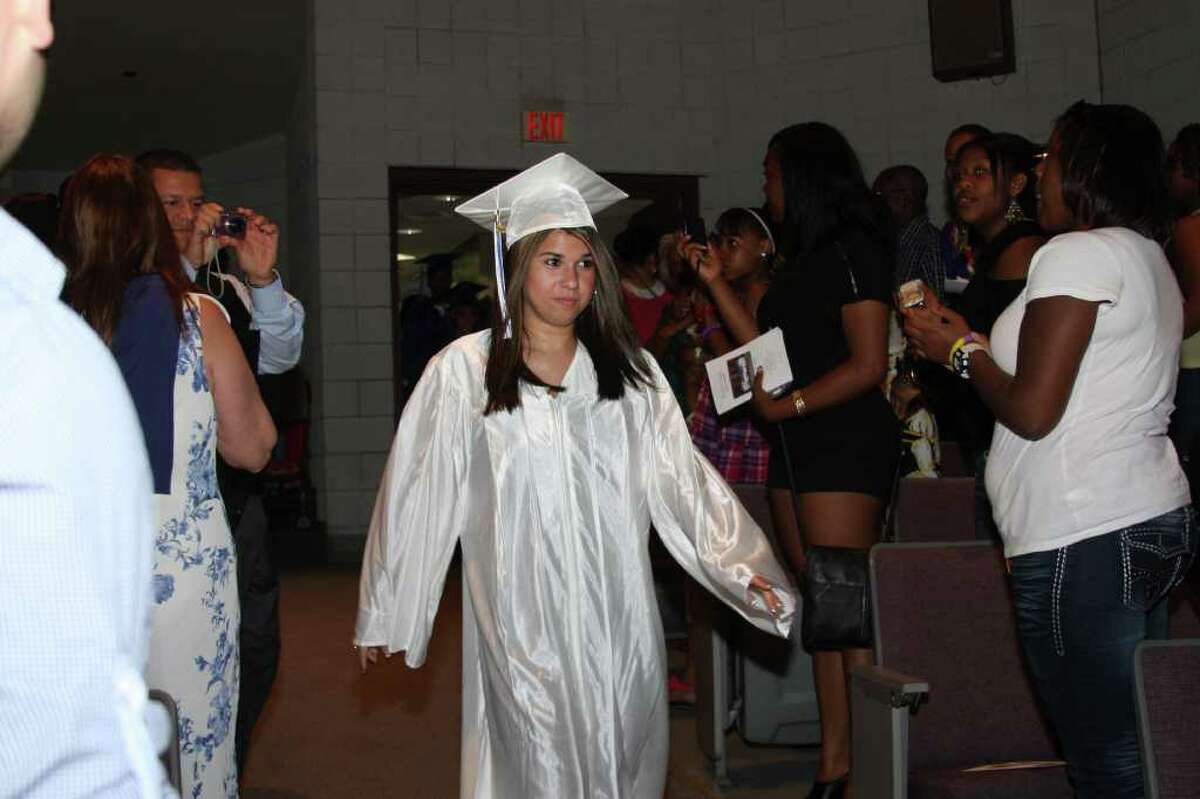 Alyssa Aguiar leads the Richard C. Briggs High School Class of 2011 into the Pepsico Theatre at Norwalk Community College for the graduation ceremony on Monday evening.