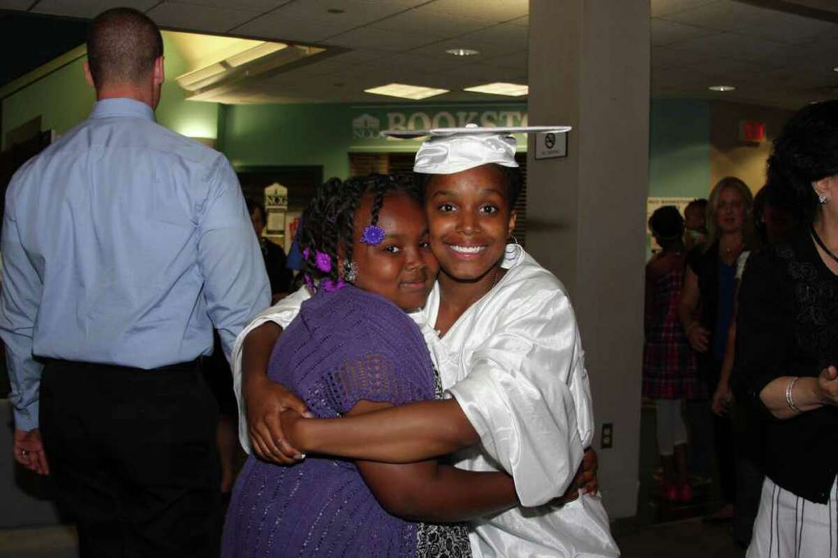 Member of Briggs' Class of 2011 Shaqouia Crenshaw gives her sister Daneesha a hug.