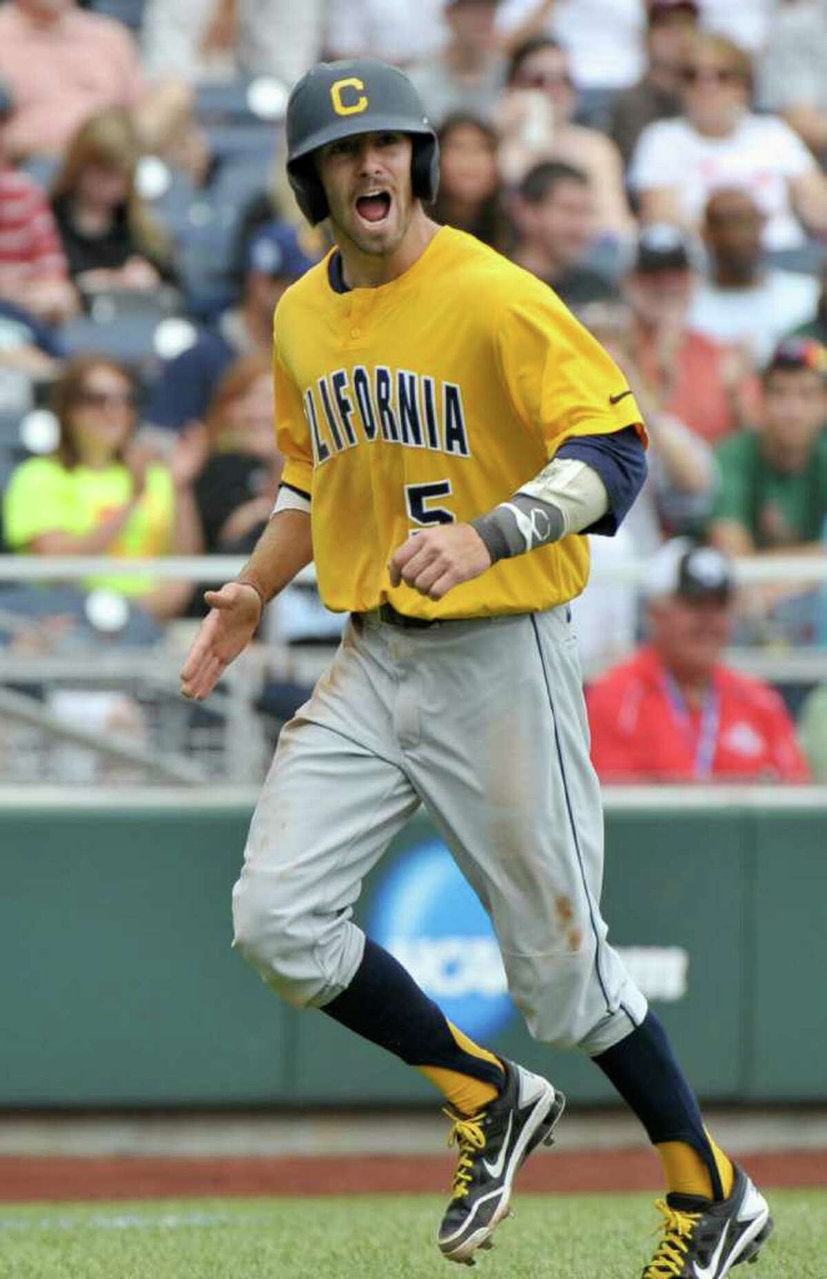 California's Derek Campbell (5) reacts after scoring against Texas A&M on a sacrifice fly by Tony Renda during the fifth inning of an NCAA College World Series elimination baseball game in Omaha, Neb., Tuesday, June 21, 2011. Campbell hit a two-run single earlier in the inning.