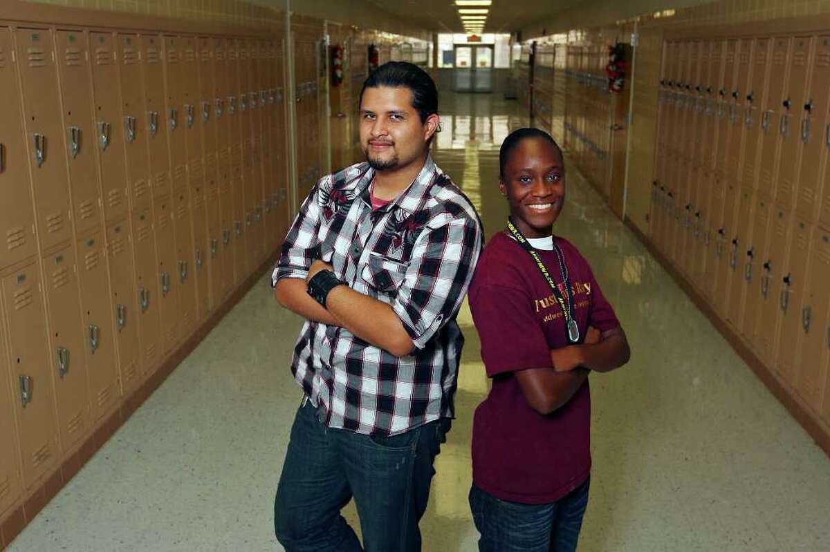 Portrait of Sam Houston High School graduate Enrique Reyes (left) and Sam Houston senior Kirsten Redmon Friday June 17, 2011 at the school. The two pre-engineering students, nominated by National Action Council for Minorities in Engineering, Inc. (NACME), have been selected to participate in the Adventures of the Mind program June 22-26, 2011, at the University of Montana, Missoula, hosted by the Dennis and Phyllis Washington Foundation. The students will meet with 50 Nobel and Pulitzer Prize winners, MacArthur fellows, renowned artists, athletes and other influential leaders. (PHOTO BY EDWARD A. ORNELAS/eaornelas@express-news.net)