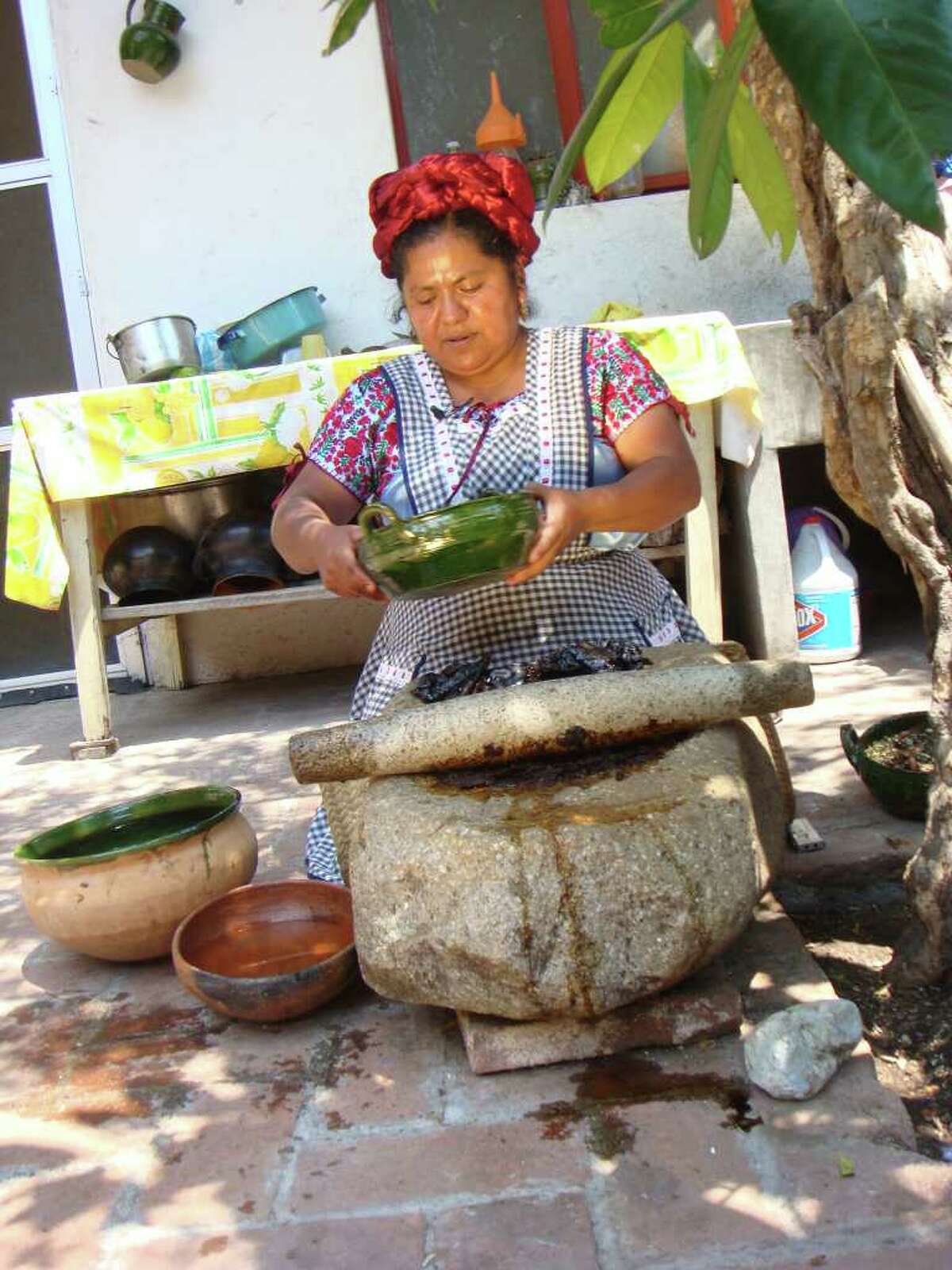 Dish: Mole. In this photo Abigail Mendoza prepares mole in Oaxaca, Mexico. Traveling Latin America in search of the culinary past and present.