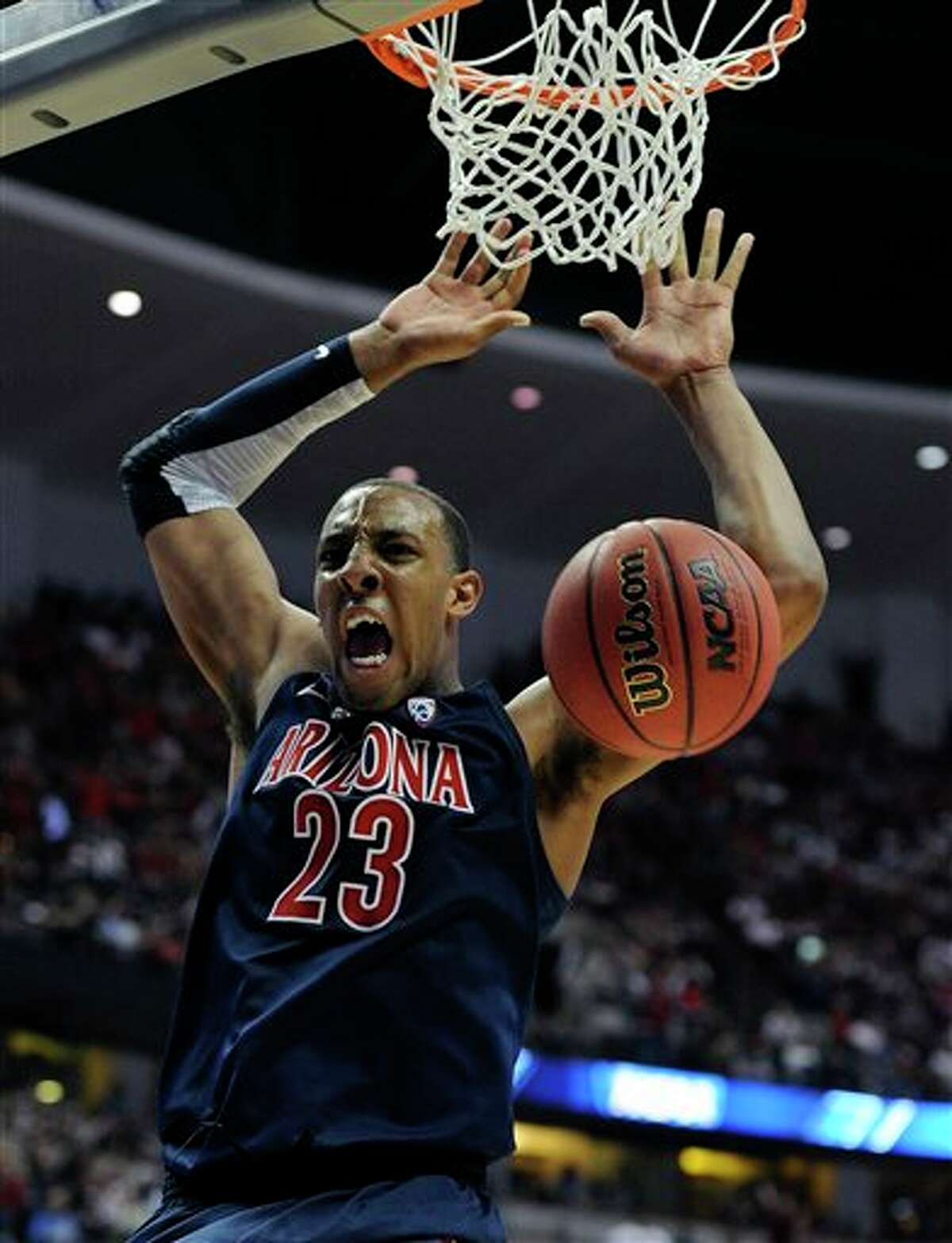 Arizona's Derrick Williams dunking during the second half of an NCAA West regional college basketball championship game, in Anaheim, Calif. Williams is a top prospect in the 2011 NBA draft. (AP Photo/Mark J. Terrill)