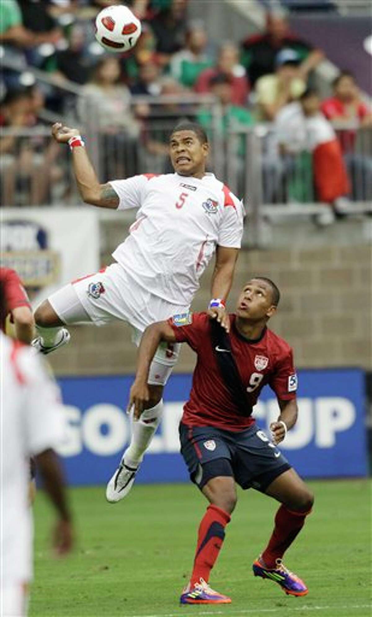Panama's Roman Torres (5) and United States' Juan Agudelo (9) go after the ball during the first half of a CONCACAF Gold Cup semifinal soccer match Wednesday, June 22, 2011, in Houston. (AP Photo/David J. Phillip)