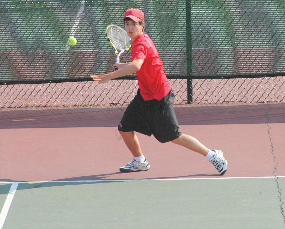 Fairfield Warde No. 1 player Ted Berkowitz returns a shot during his win against Ludlowe on April 25. Berkowitz achieved All-State status this year, reaching the Class L semifinals.