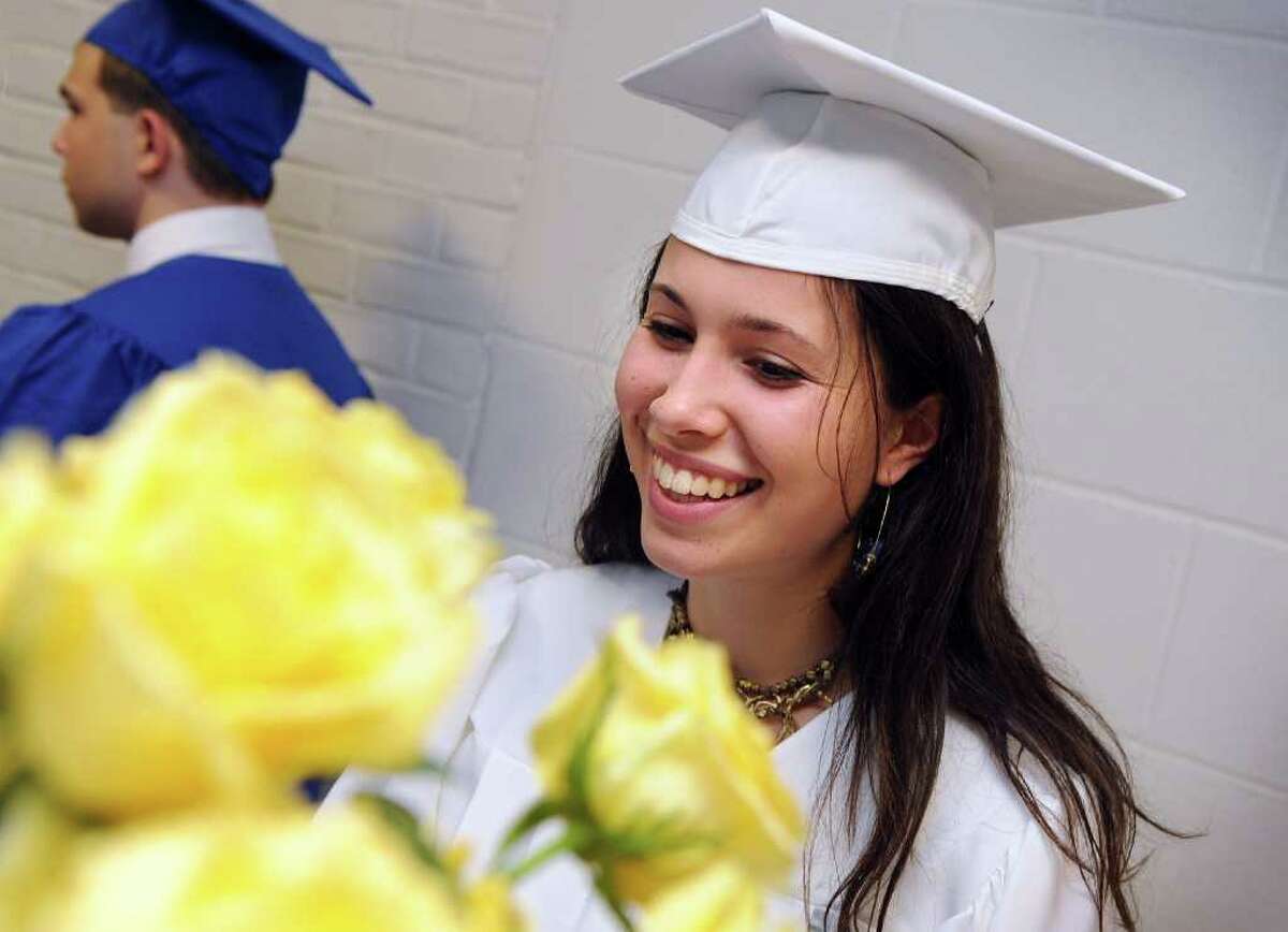 Graduate Grace Poudrier selects a yellow rose before the start of Fairfield Ludlowe High School's commencement ceremony Thursday, June 23, 2011.