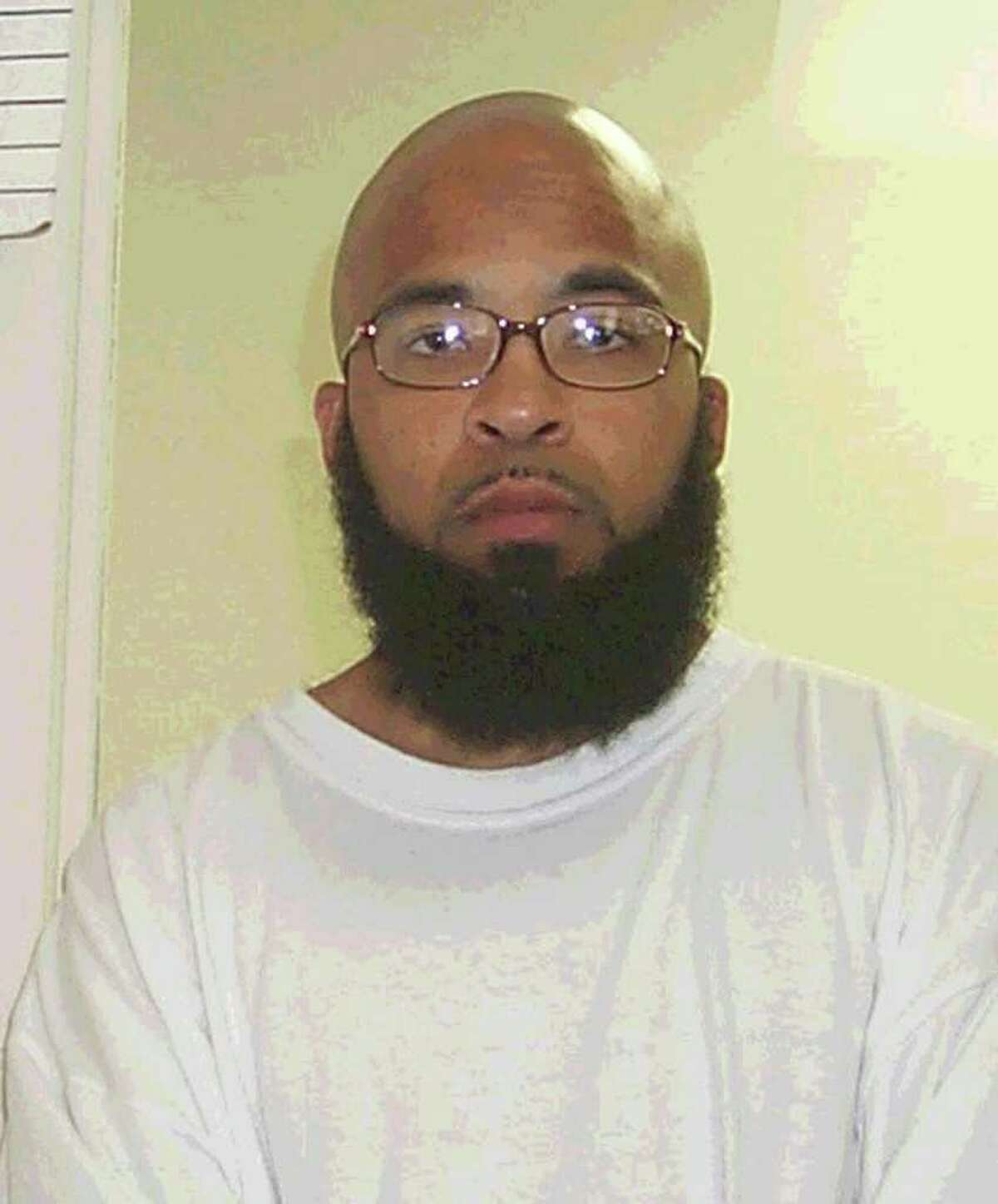 This is a 2004 photo provided by the Washington State Department of Corrections showing Abu Khalid Abdul-Latif, also known as Joseph Anthony Davis, of Seattle. Davis, and Walli Mujahidh, also known as Frederick Domingue Jr., of Los Angeles, were arrested Wednesday night, June 22, 2011. They men were arrested at a warehouse garage when they arrived to pick up machine guns to use in an alleged terror plot.