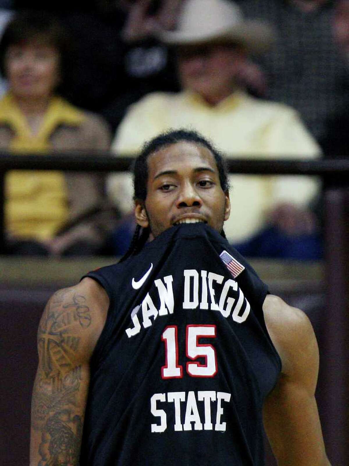 San Diego State forward Kawhi Leonard bites his jersey during an NCAA college basketball game against Wyoming on Tuesday, March 1, 2011, in Laramie, Wyo.