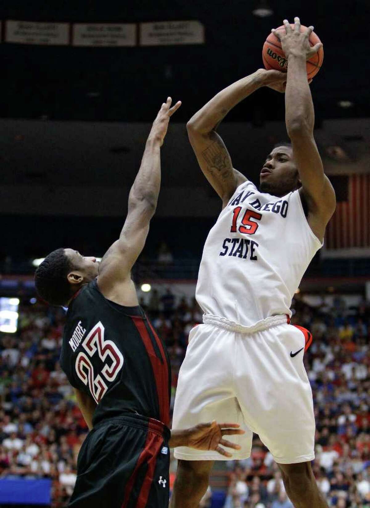 San Diego State's Kawhi Leonard (15) shoots over Temple's Ramone Moore (23) during a West Regional NCAA college basketball tournament third round game Saturday, March 19, 2011, in Tucson, Ariz.