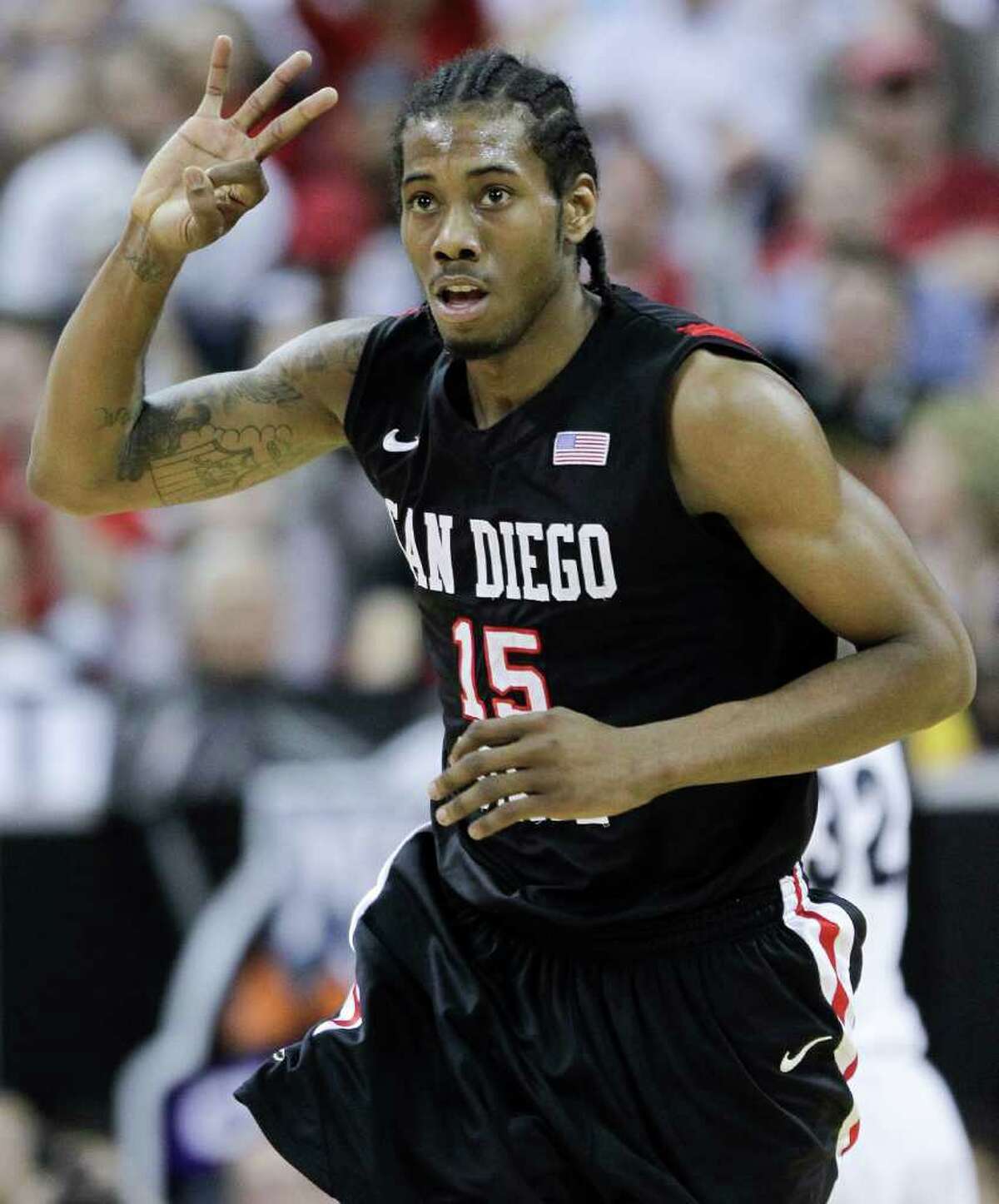 San Diego State's Kawhi Leonard gestures after hitting a three-point basket during the first half of an NCAA college basketball championship game against BYU in the Mountain West Conference tournament, Saturday, March 12, 2011, in Las Vegas. San Diego State won 72-54.