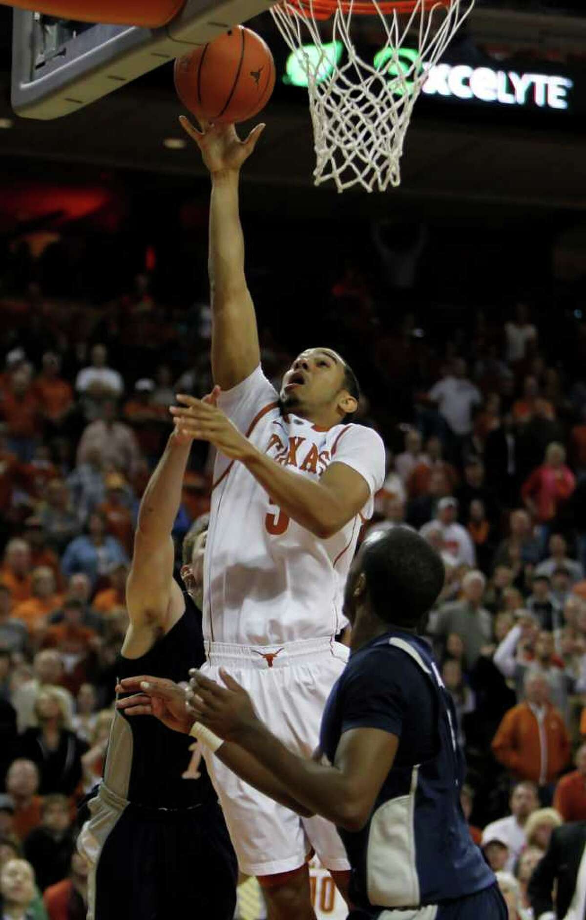 Texas' Cory Joseph (5) goes for a shot against Rice during an NCAA college basketball game in Austin, Texas, Saturday, Nov. 27, 2010. Joseph was Texas high-scorer with 14 points. Texas defeated Rice 62-59. (AP Photo/Erich Schlegel)