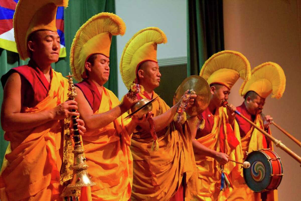 Gaden Shartse Monks, from a monastery in Karnataka, India, perform the "Kangso," "a ritual of fulfillment," at the Seattle Asian Art Museum Thursday.