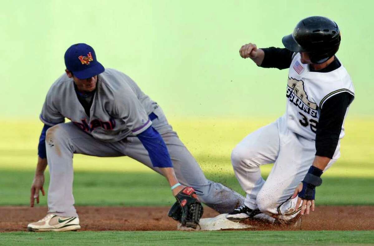 Missions' Daniel Robertson steals second base ahead of the tag from Rockhounds' Grant Green during the third inning.