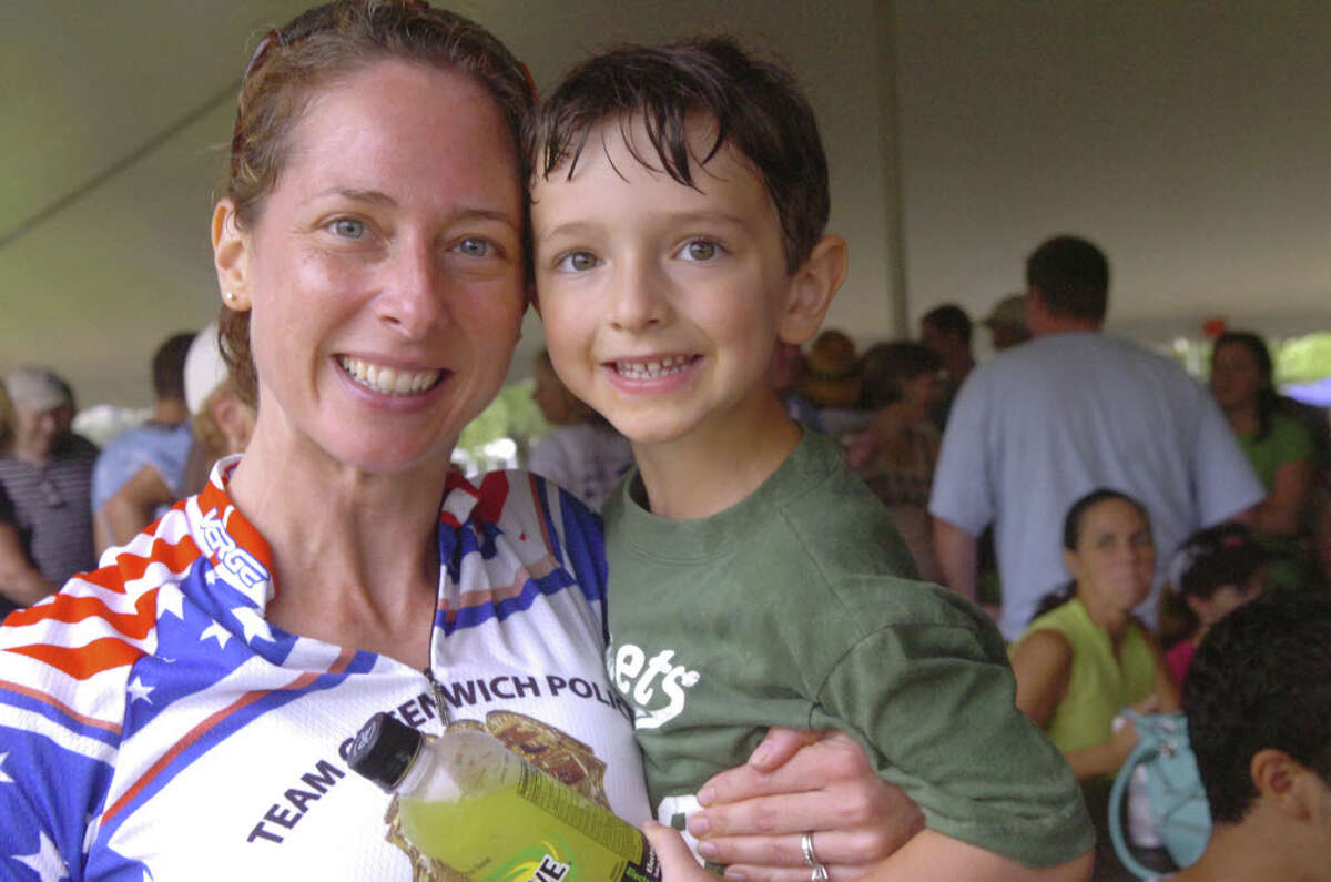 Greenwich police detective Christy Girard and her son, Harris, 4, at the barbeque after the three-day bicyle ride to raise money for the fight against ALS, on Sunday, July 25, 2010.