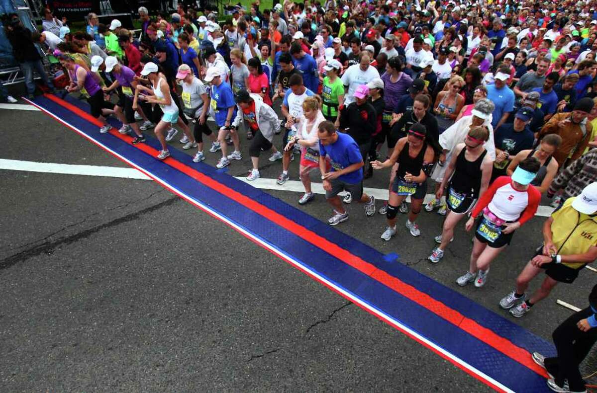 Runners begin the Dodge Rock ‘n’ Roll Seattle Marathon & Half Marathon in Tukwila on Saturday.