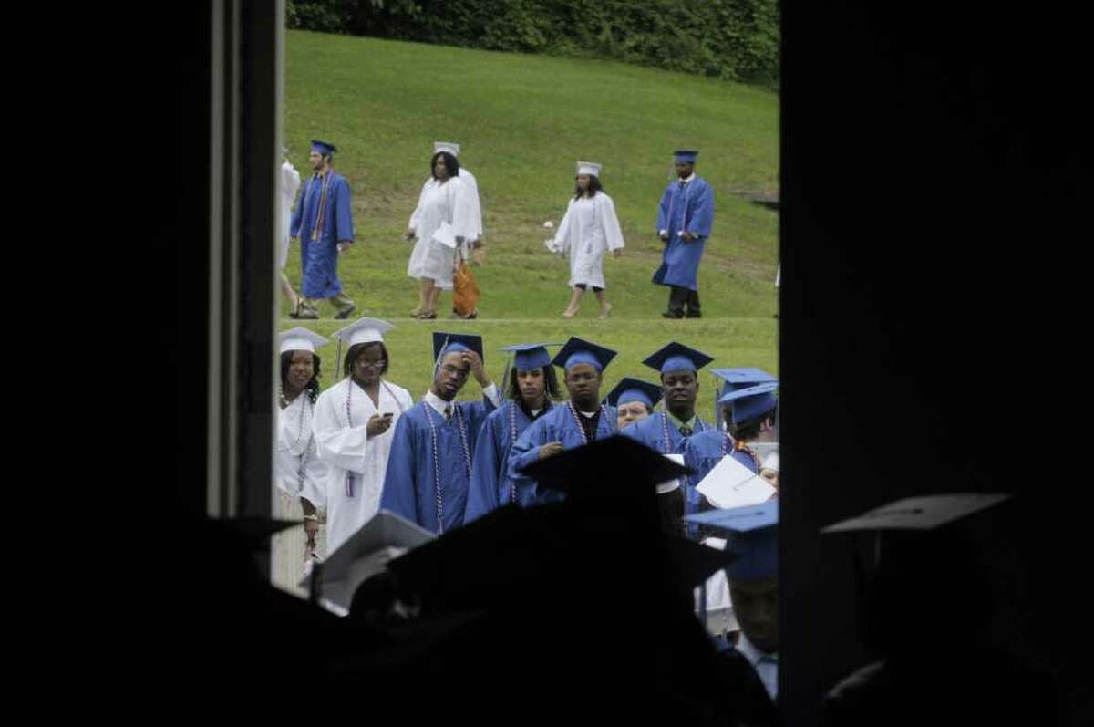 Graduates line up outside as they get set to enter during the Albany High School commencement at the SEFCU Arena on the campus of the University at Albany. A total of 449 students graduated and close to 90% plan to attend college. (Paul Buckowski / Times Union)
