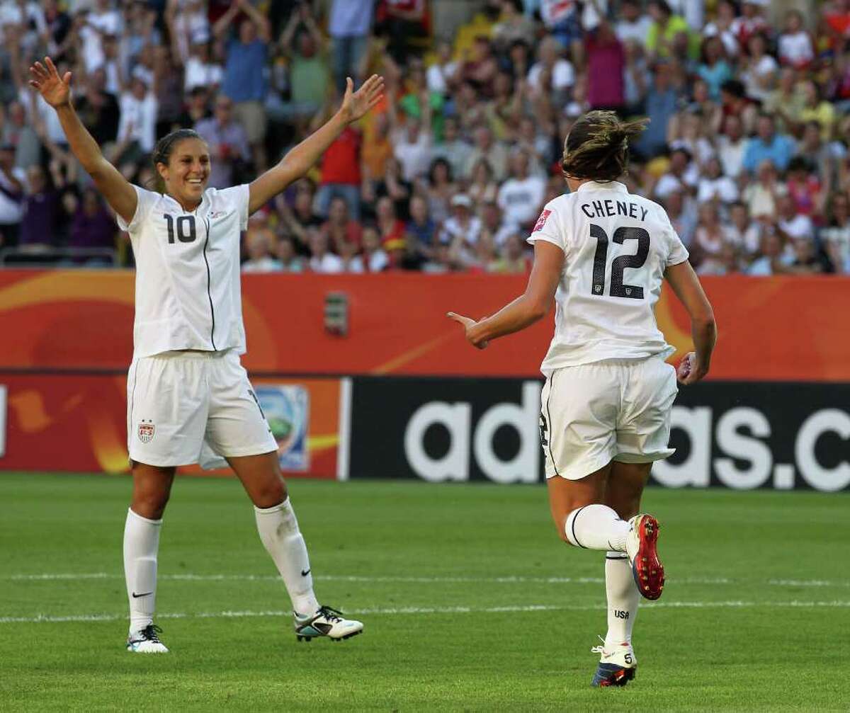 Lauren Cheney of the U.S.(right) celebrates the first goal with teammate Carli Lloyd during the FIFA Women's World Cup Group C match between USA and North Korea at Rudolf-Harbig-Stadion on June 28, 2011 in Dresden, Germany.