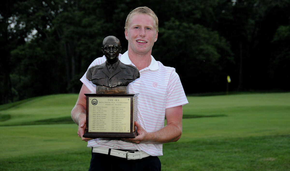 Norwalk's Tommy McDonagh holds the winner's trophy after winning the 56th Ike Championship in a playoff at Somerset Hills Country Club in Bernardsville, N.J. on Tuesday, June 28, 2011.