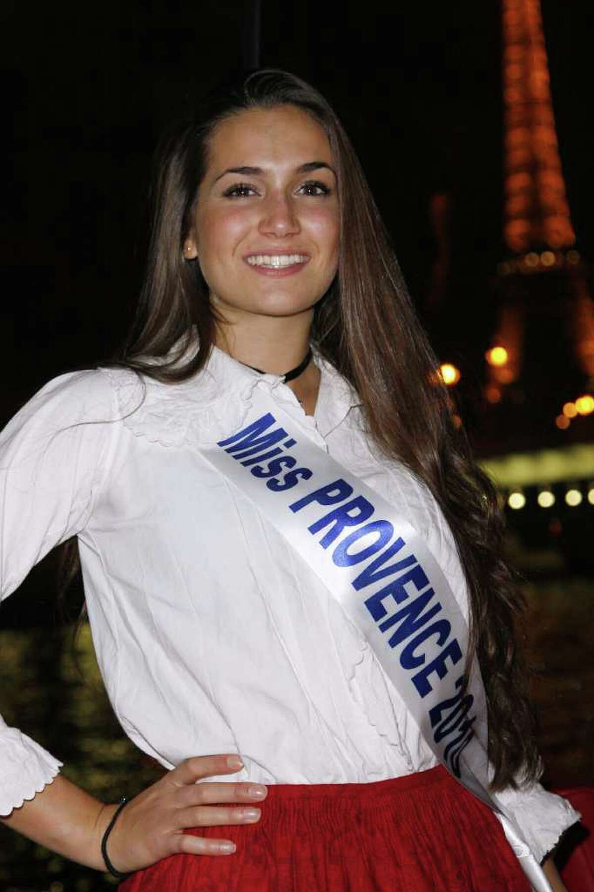 CLICK HERE: TP turning heads in Paris with new girlfriend Miss Provence Barbara Morel poses in a traditional costume during a dinner party organised on a bateau mouche (tourist boat) on the Seine river near the Eiffel Tower on December 03, 2010 in Paris. The 2011 "Miss Nationale" Beauty contest will take place in Paris on December 5, 2010. AFP PHOTO THOMAS SAMSON