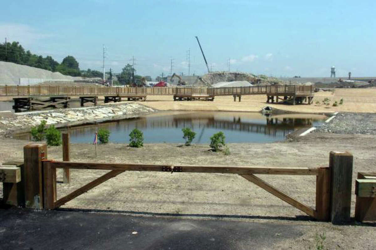 Wooden walkways and a pond are among the environmental restoration projects on the site of the Fairfield Metro Railroad Station under construction off lower Black Rock Turnpike.