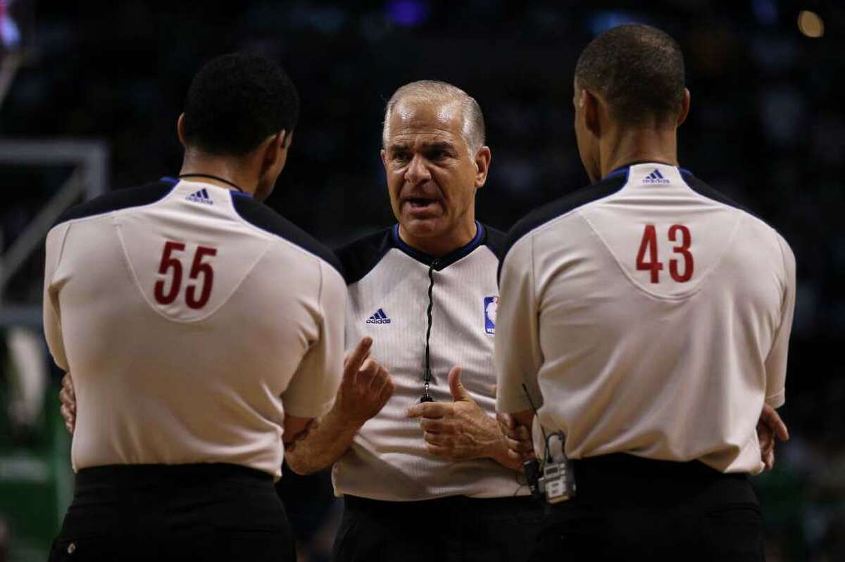 BOSTON - JUNE 08: (L-R) Referees Bill Kennedy #55, Bennett Salvatore and Dan Crawford #43 talk during a stop in play between the Los Angeles Lakers and the Boston Celtics in Game Three of the 2010 NBA Finals on June 8, 2010 at TD Garden in Boston, Massachusetts. NOTE TO USER: User expressly acknowledges and agrees that, by downloading and/or using this Photograph, user is consenting to the terms and conditions of the Getty Images License Agreement. (Photo by Elsa/Getty Images) *** Local Caption *** Bill Kennedy;Dan Crawford;Bennett Salvatore