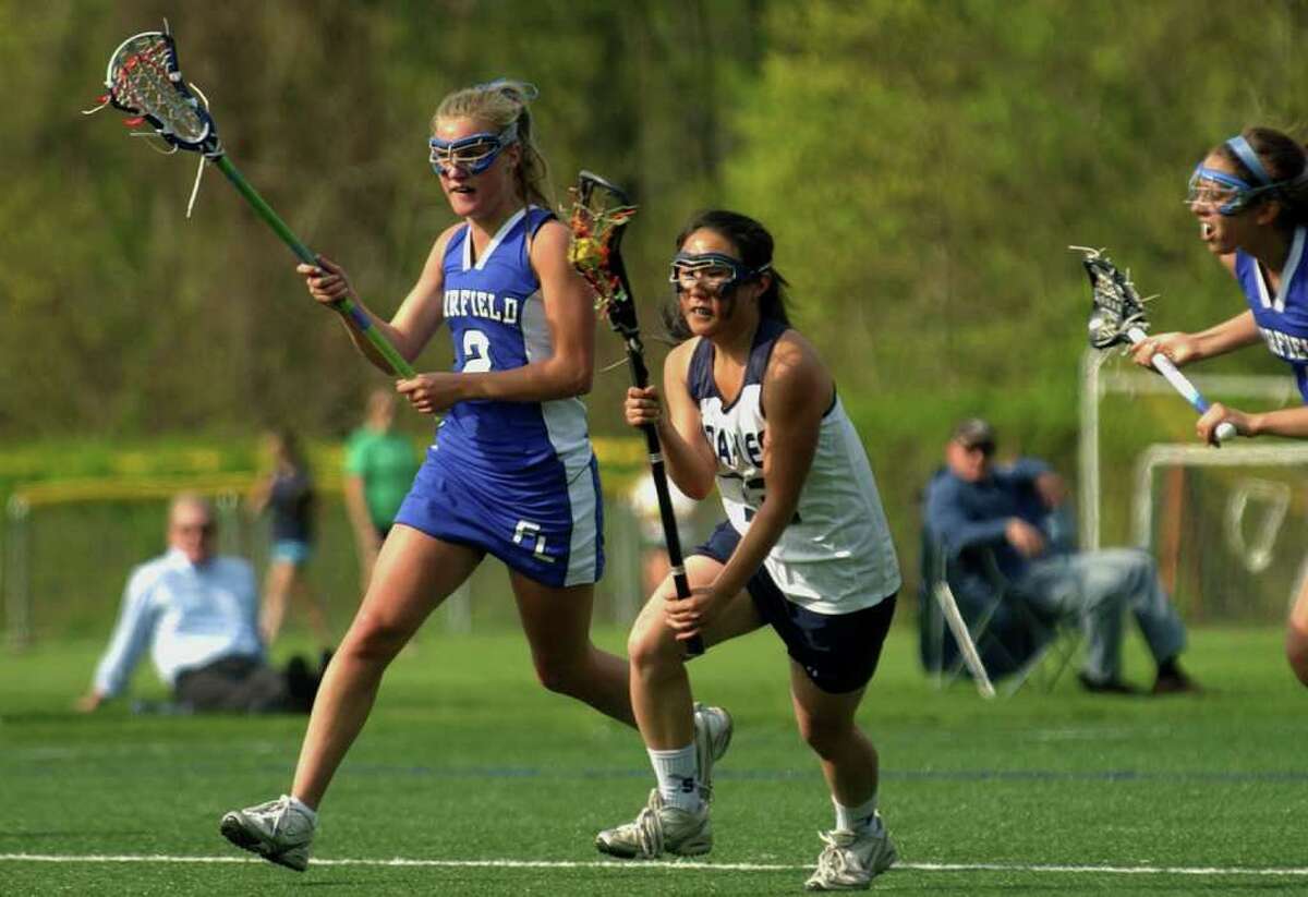 Highlights from girls lacrosse between Fairfield Ludlowe and Staples in Westport, Conn. on Tuesday May 3, 2011. Staples' Nikki Seo, center.
