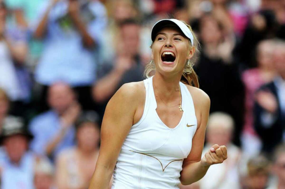 LONDON, ENGLAND - JUNE 30: Maria Sharapova of Russia celebrates after winning her semifinal round match against Sabine Lisicki of Germany on Day Ten of the Wimbledon Lawn Tennis Championships at the All England Lawn Tennis and Croquet Club on June 30, 2011 in London, England. (Photo by Clive Mason/Getty Images)