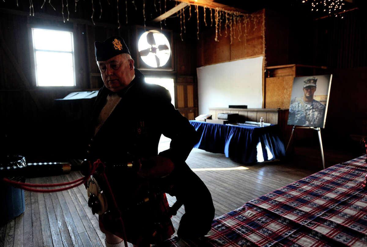 Bagpiper Stuart Simms prepares to play "Amazing Grace" at the memorial service of Army Sgt. Glenn Sewell of the 1st Cavalry Division. The service was at Anhalt Hall in Spring Branch on June 30, 2011.