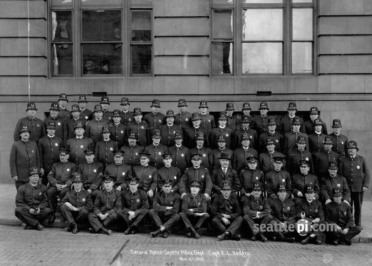 This photo of the Seattle Police Department Second Patrol, taken Nov. 11, 1919. Eighth from the left in the second row from the bottom is Roy Olmstead.