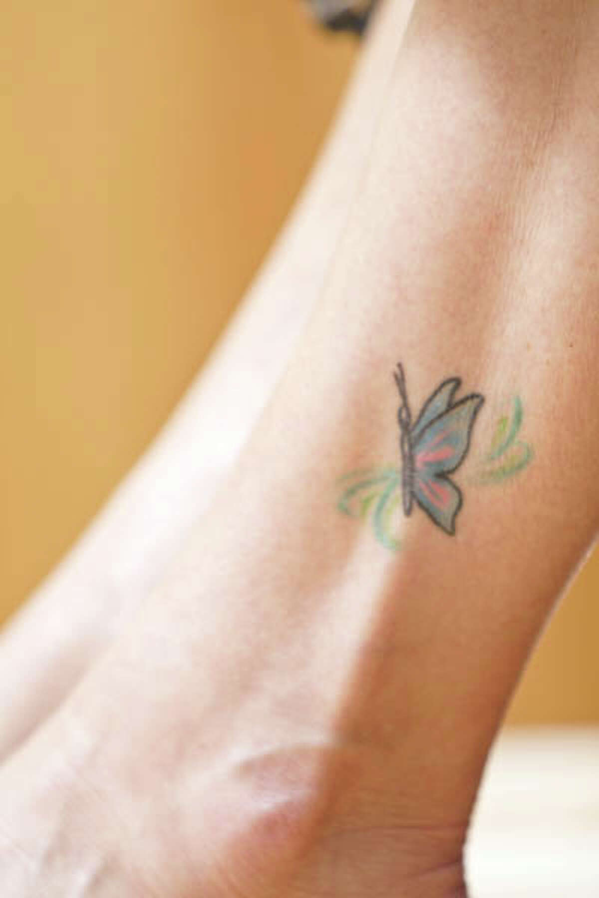 HealthyLife cover model Pam Lejeunesse, 53, of Clifton Park, got a butterfly tattoo on her ankle as a way to bond with her daughters, Heather and Ashley, during a vacation in Virginia a few years ago. "It was spur-of-the-moment to an extent, although we planned it once we were down there, choosing the place to go and the designs we wanted," she says. "We had been talking about getting tattoos for a long time." (Photo by Suzanne Kawola/HealthyLife)