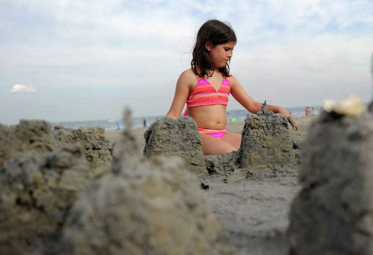 Miranda Huff, 8, builds a sand castle at Greenwich Point on Saturday, July 2, 2011.