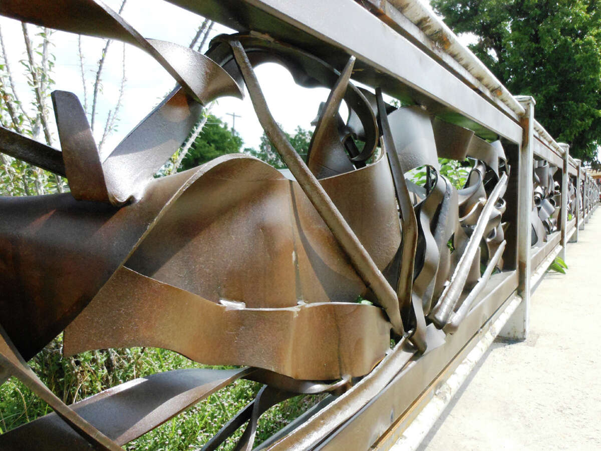 George Schroeder cut strips of steel with a laser, heated them to 2,200 degrees, then bent and hammered them to create these harmonious forms. STEVE BENNETT / EXPRESS-NEWS