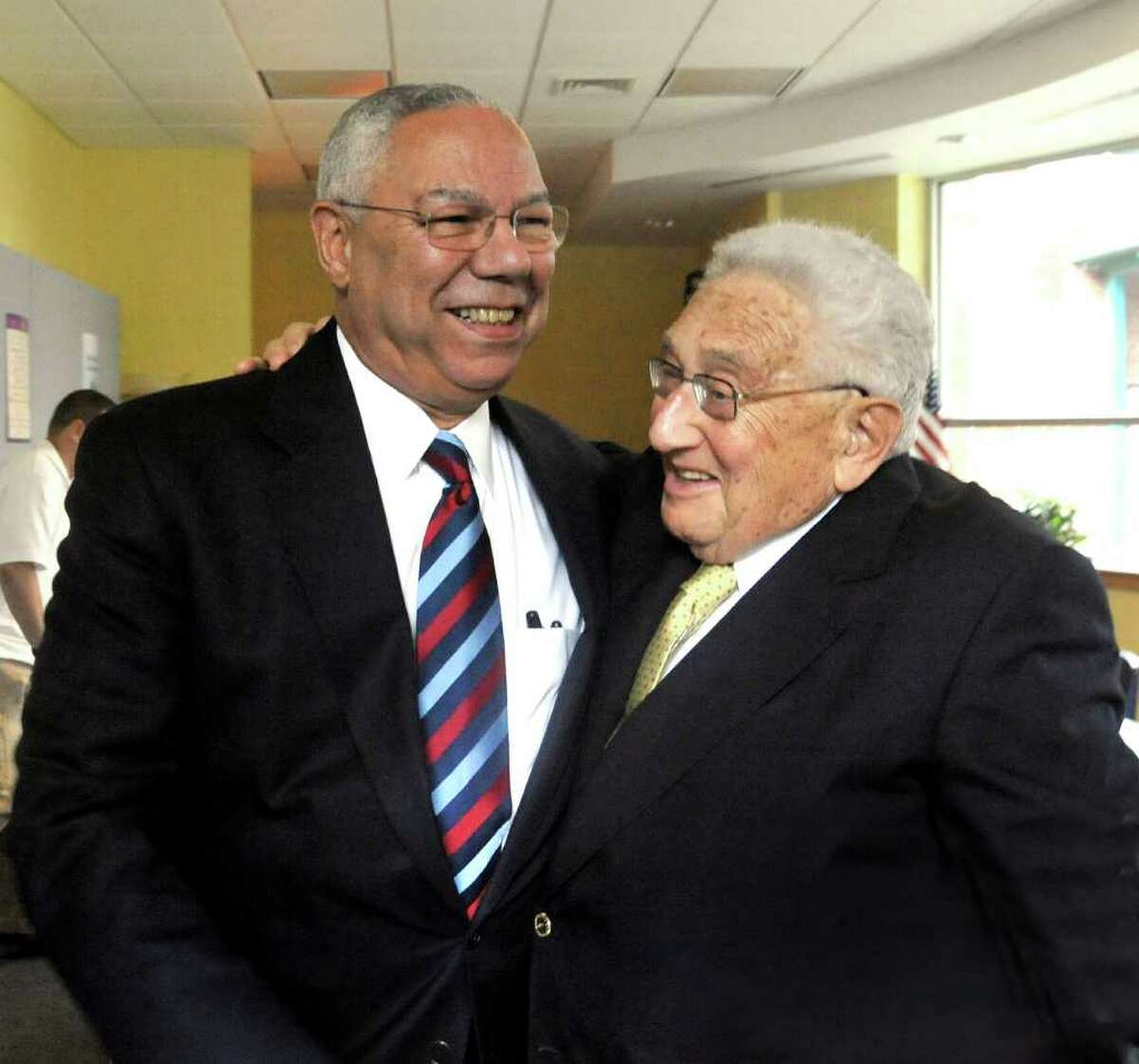 General Colin Powell, left, greets Henry Kissinger upon Powells arrival at the Kent Center School to speak at the Kent Lecture Series at the Library, Sunday, July 3, 2011.