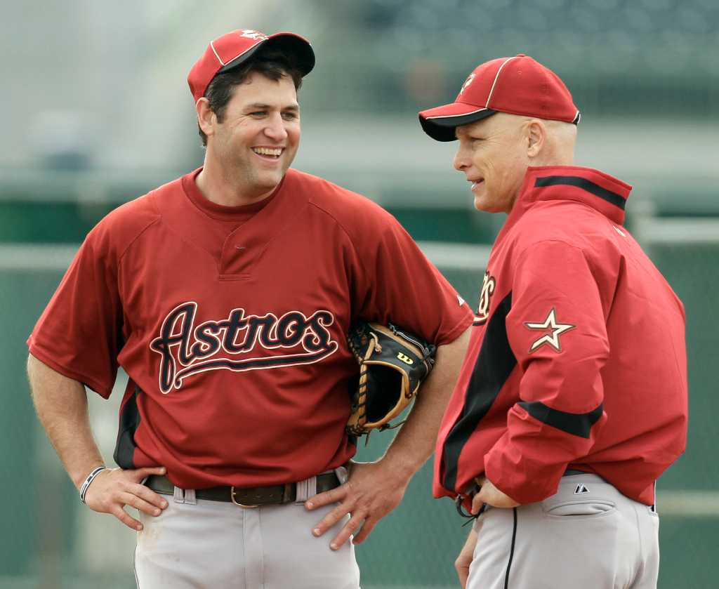 Houston Astros' Lance Berkman walks back to the dugout after