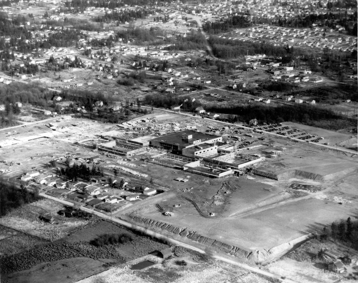 An aerial view of Northgate looking northeast, Dec. 6, 1949. In the foreground is First Avenue Northeast and a tract of homes. The homes there and in the upper left center are now part of the mall. The Bon Marche building, now Macy's, is the largest building pictured here.