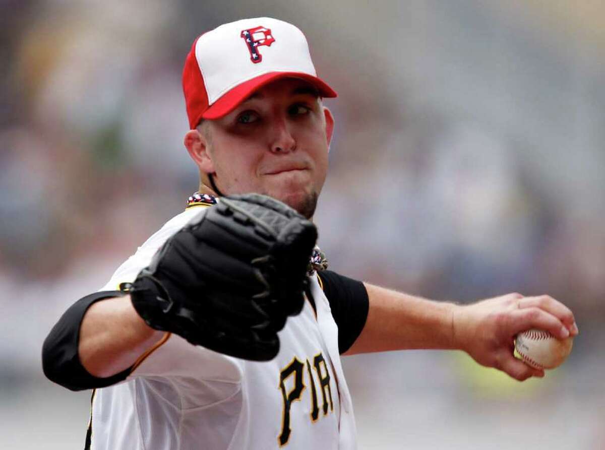 Pittsburgh Pirates pitcher Paul Maholm throws in the first inning against the Houston Astros during a baseball game in Pittsburgh Monday, July 4, 2011.