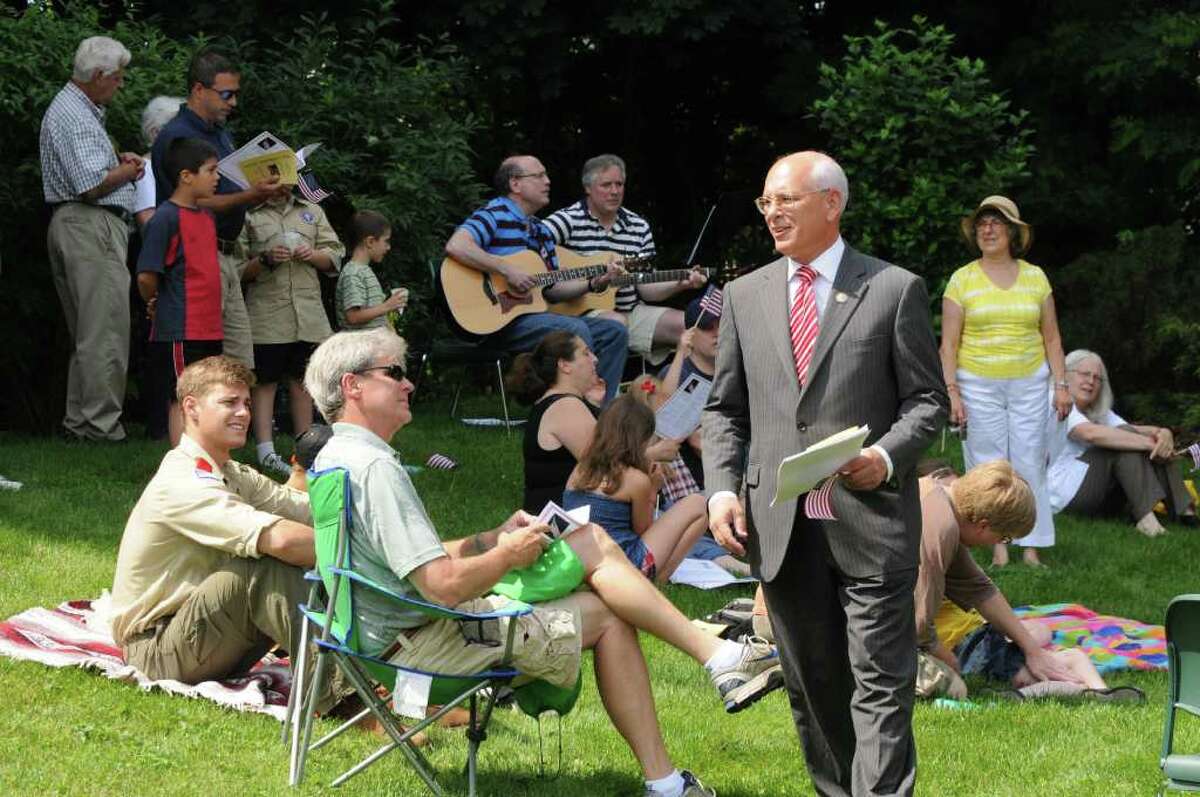 U.S. Rep. Paul Tonko, right, mingles with the crowd outside Bethlehem Town Library in Delmar N.Y., , Monday morning July, 4 2011, before taking part in a reading of the declaration of independence. (Will Waldron /Times Union)