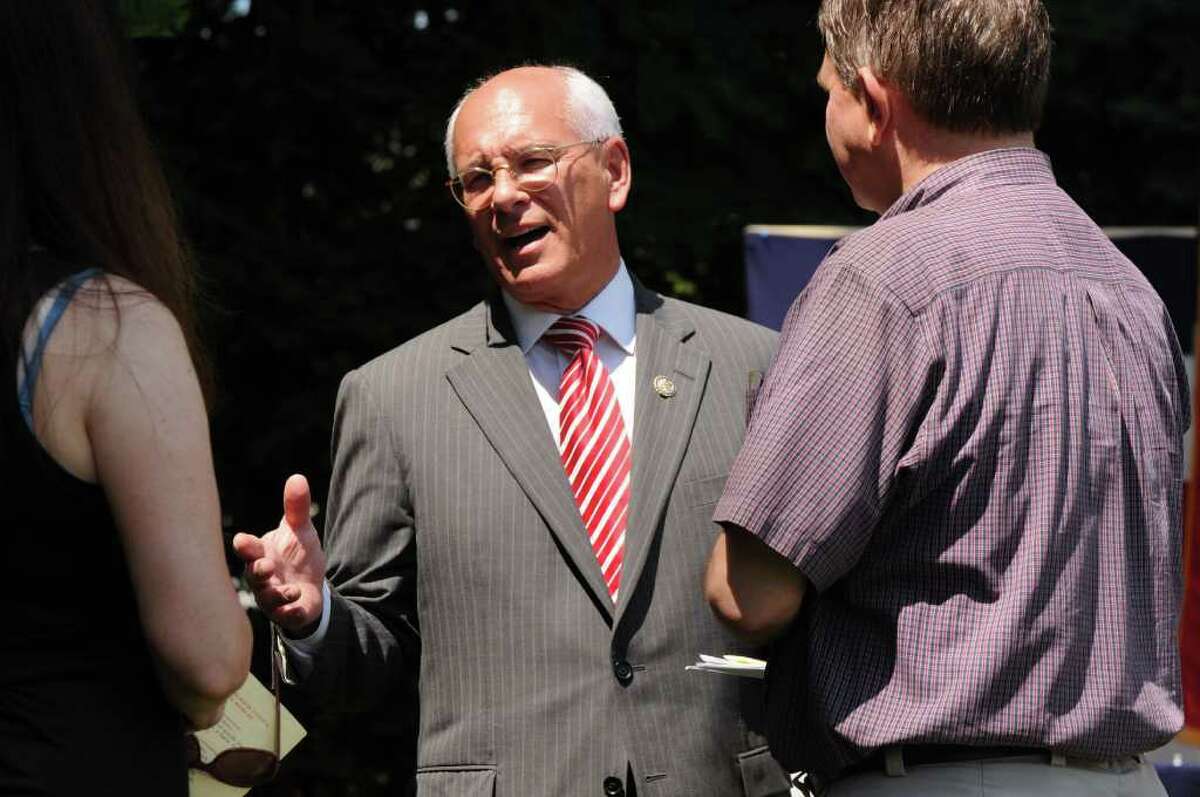 U.S. Rep. Paul Tonko, center, chats with Jill, left, and Steve Baboulis, right of Bethlehem following a reading of the declaration of independence at Bethlehem Town Library in Delmar N.Y., Monday July, 4 2011. (Will Waldron /Times Union)