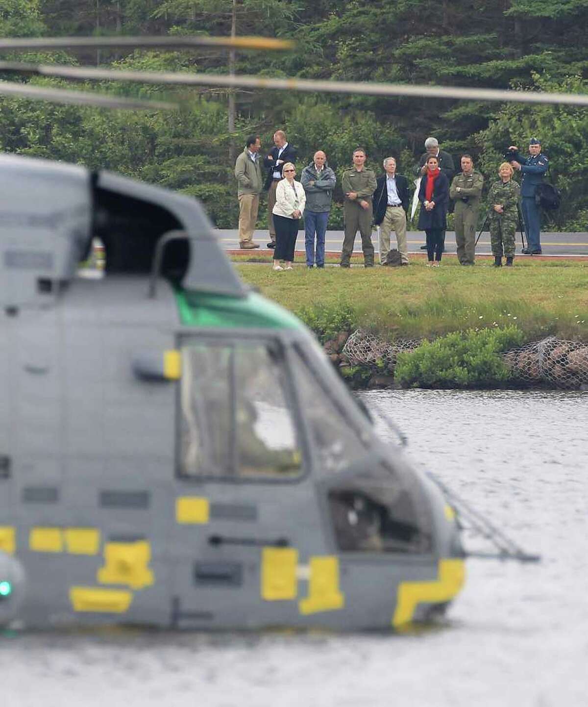 CHARLOTTETOWN, PE - JULY 04: Prince William, Duke of Cambridge takes part in an exercise in a Sea King Helicopter as Catherine, Duchess of Cambridge watches from the shore on Dalvay lake on July 4, 2011 in Charlottetown, Canada. The newly married Royal Couple are on the fifth day of their first joint overseas tour. The 12 day visit to North America is taking in some of the more remote areas of the country such as Prince Edward Island, Yellowknife and Calgary. The Royal couple started off their tour by joining millions of Canadians in taking part in Canada Day celebrations which mark Canada's 144th Birthday. (Photo by Chris Jackson/Getty Images)