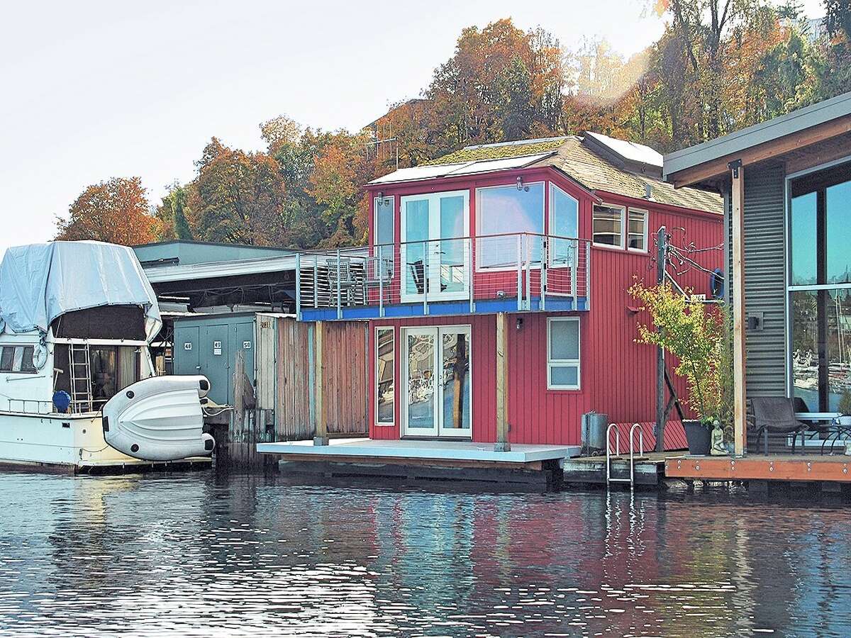 Now that summer seems finally to have arrived in Seattle, it's a good time to look at one of the city's more unique living options -- the floating home. Here are three along Westlake Avenue North, on Lake Union, starting with this home at 2764 Westlake Ave. N., unit G. The end-of-dock home features tons of wood, two three-quarter bathrooms, with towel warmers, and a large master suite created from what had been two bedrooms. It was built in 1978 and is listed for $825,000. (Listing: http://www.cbbain.com/Pages/PropertyDetail.aspx?ListingID=33040208&NAV=1)