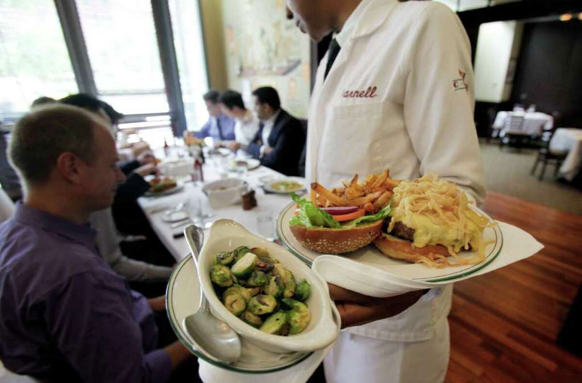 In this June 29, 2011 photo, lunch is served to diners at The Palm restaurant in New York's Tribeca neighborhood. The U.S. service sector, which employs nearly 90 percent of the country?s work force, expanded for a 19th consecutive month in June but at a slower pace than in May. (AP Photo/Richard Drew)