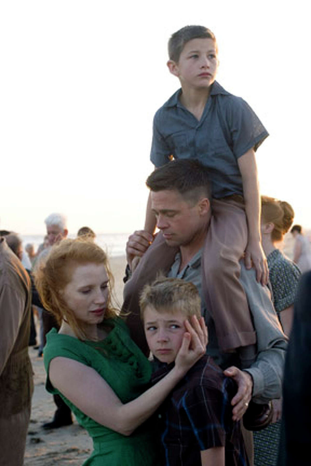 (Clockwise from left) Jessica Chastain as Mrs. O'Brien, Tye Sheridan as Steve, Brad Pitt as Mr. O'Brien and Laramie Eppler as R.L. in "The Tree of Life."