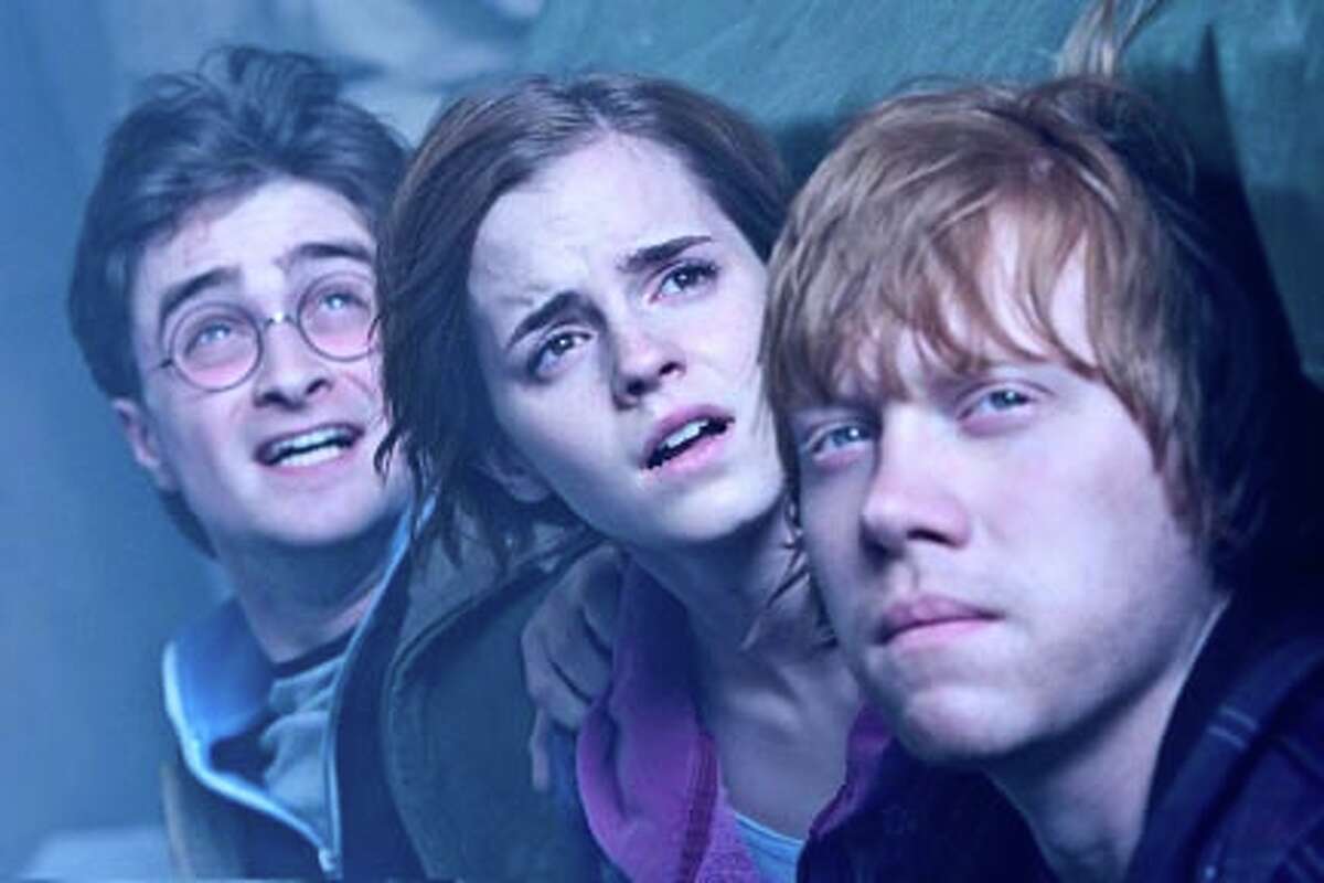 (L-R) Daniel Radcliffe as Harry Potter, Emma Watson as Hermione Granger and Rupert Grint as Ron Weasley in "Harry Potter and the Deathly Hallows: Part 2."