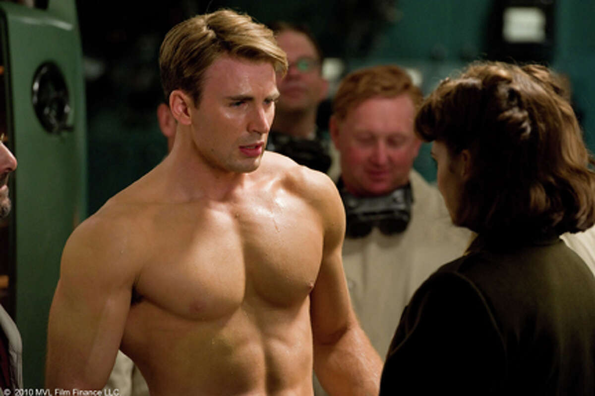 (Foreground, L-R) Chris Evans as Steve Rogers and Hayley Atwell as Peggy Carter in "Captain America: The First Avenger."