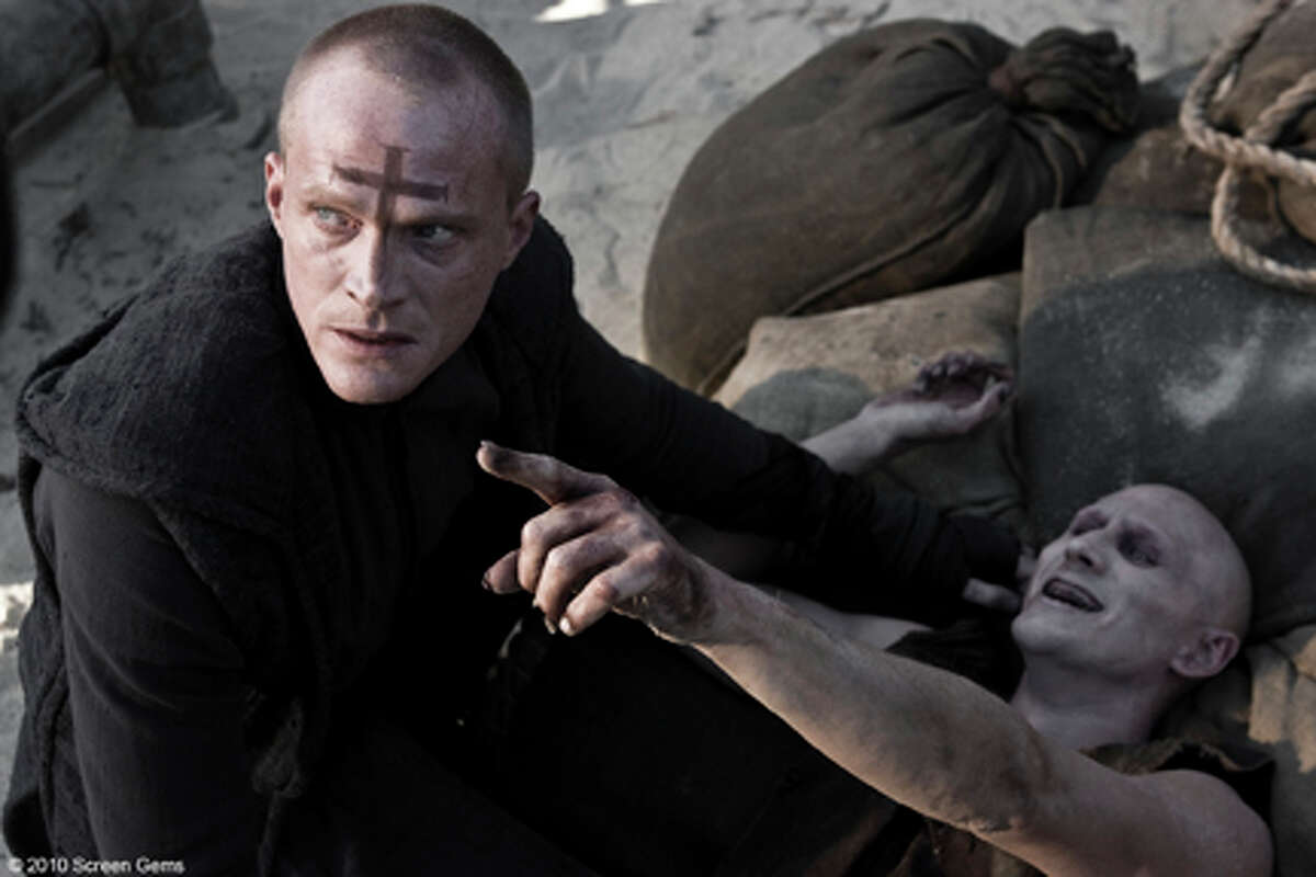 (Left) Paul Bettany as Priest in "Priest."