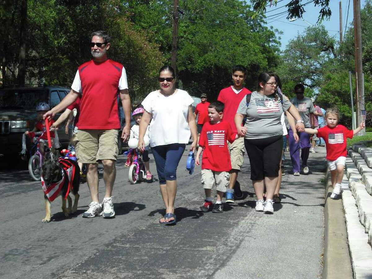 Paradegoers head for Landa Library as part of the Monte Vista Historical Association’s Independence Day parade Monday.