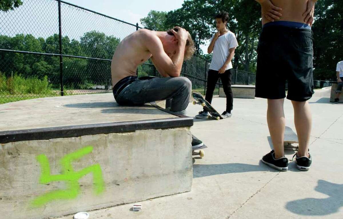 A group of teens skateboard in the skate park in Scalzi Park in Stamford, Conn. Wednesday July 6, 2011. The park was vandalized with racist graffiti sometime in the past few weeks.