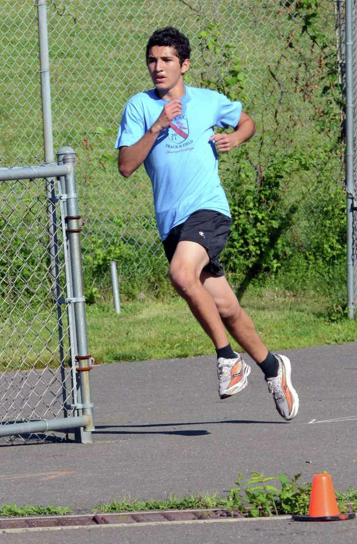 Edwin Rosales, 16, of Norwalk, races to the finish line during the first race in the Westport Road Runners Summer Series on Saturday, July 2, 2011. Rosales, a junior at Norwalk High School, placed first for the men completing the course in 12:29.