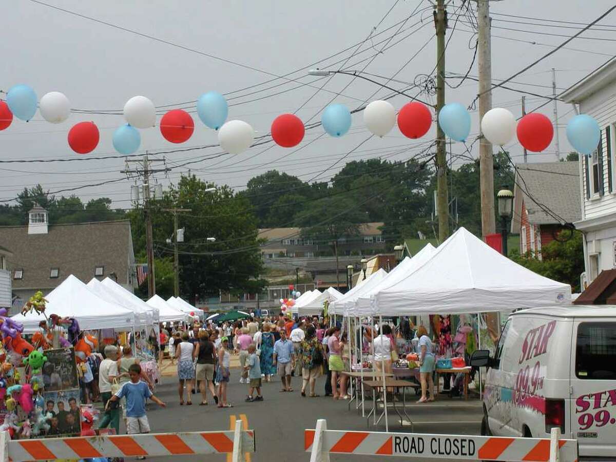 People enjoy the 10th annual Bastilles Day street fair in 2009. The event, which will take place Sunday, July 10, for the twelfth consecutive year, will feature French food, games and music in celebration of Bastilles Day.