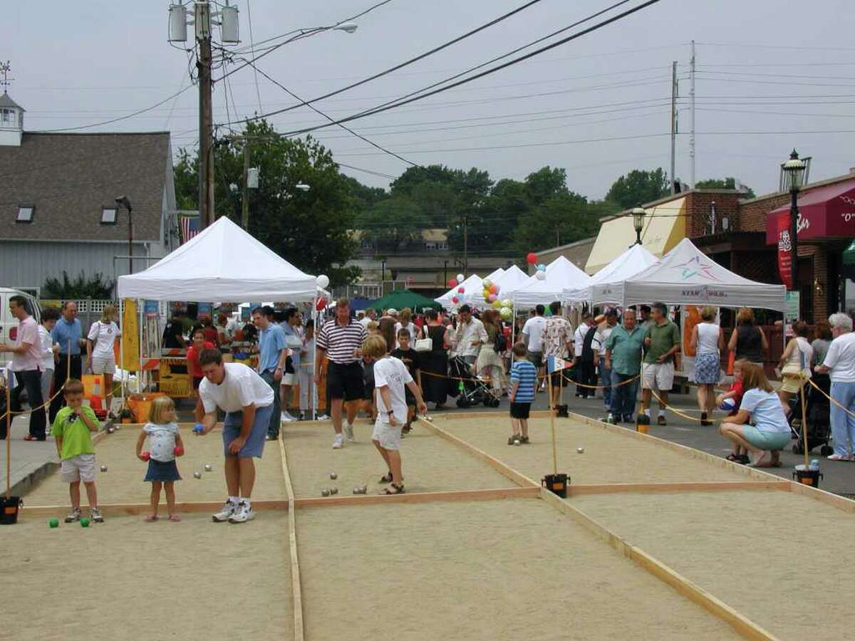 Attendees at the 10th annual Bastilles Day street fair in 2009 play petanque, a French game similar to bocce.